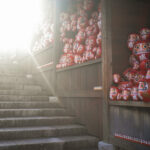Traditional Japanese Daruma dolls display staircase.