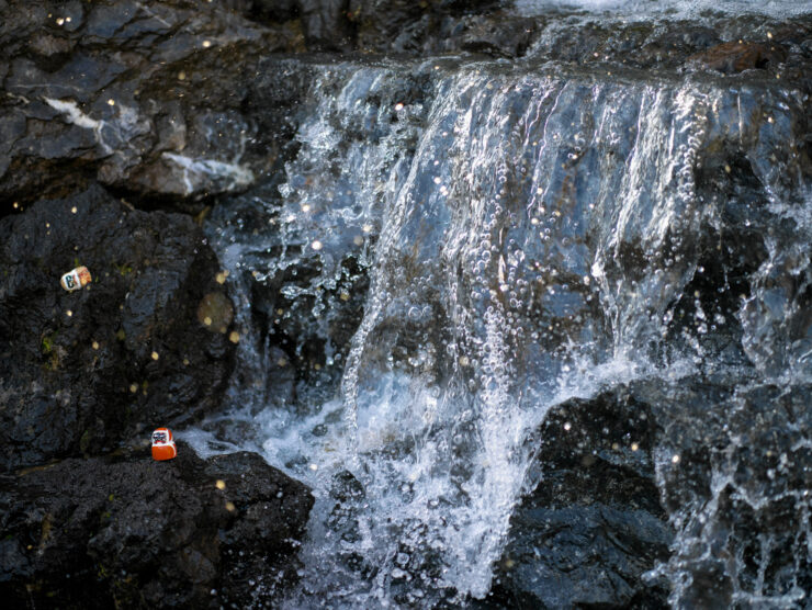 Majestic waterfall cascading rocky cliffs.