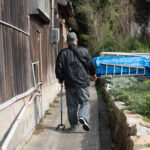 Aging residents solitary path, Manabe-shimas rural isolation.