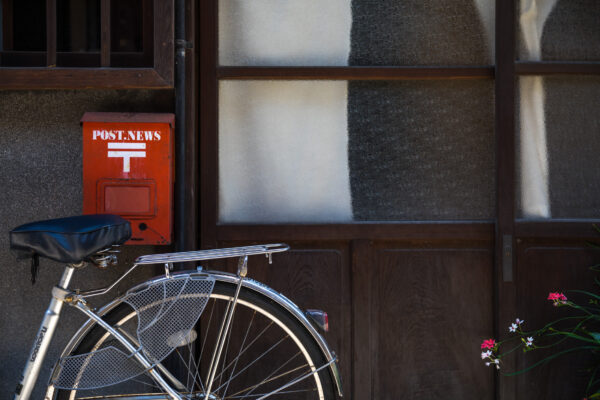 Nostalgic Japanese street scene with bicycle blossoms.