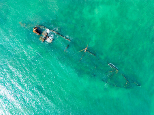 Vibrant aerial view of Sakaiura Beachs turquoise waters