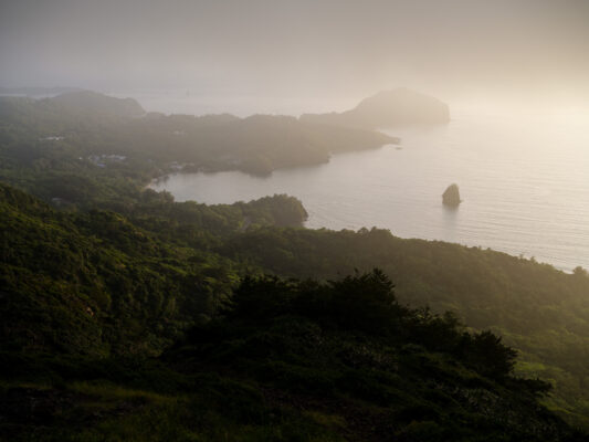 Tranquil Hazy Coastal Scenery with Lake