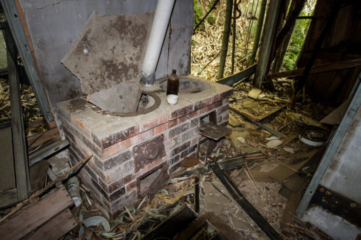 Decaying smallpox isolation ward fireplace remnants.