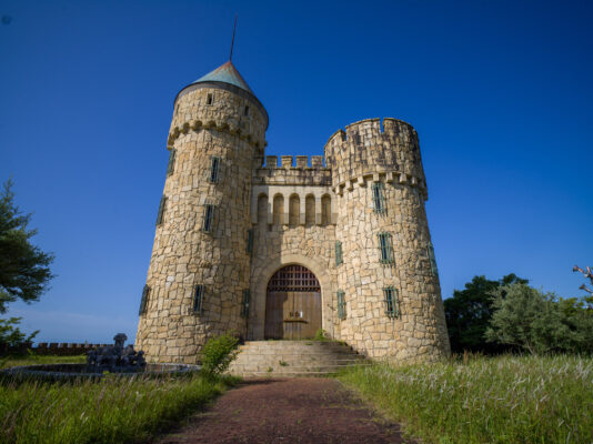 Historic medieval castle amidst lush scenery