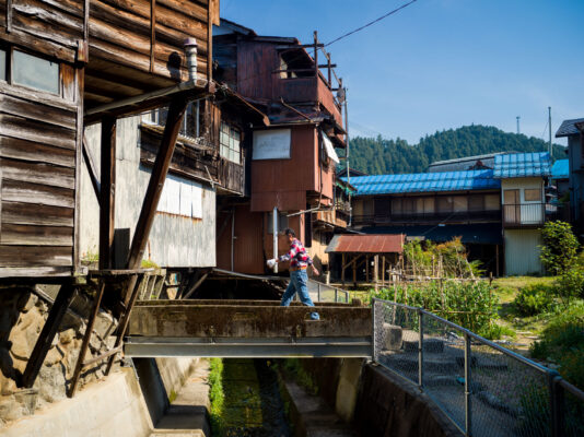 Historic rustic village nestled in lush mountains.