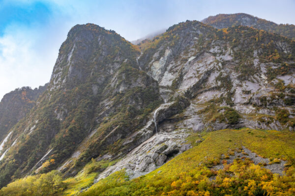 Rugged autumn mountains, wildflowers, waterfalls