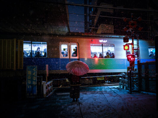 Neon Tokyo subway commuter with red umbrella