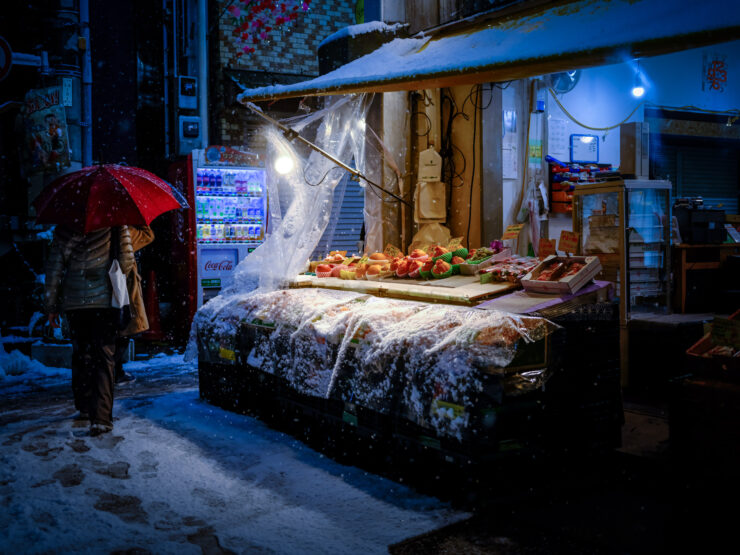 Cozy snowy mountain town market evening scene