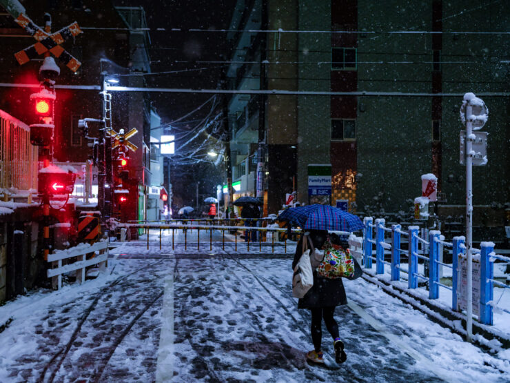 Illuminated snowy city night stroll