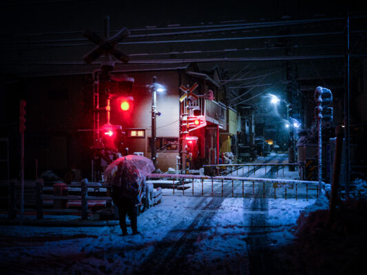 Enchanting snowy village street illuminated at night