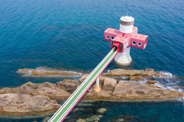 Vibrant red cross-shaped Ashizuri Lighthouse beacon.