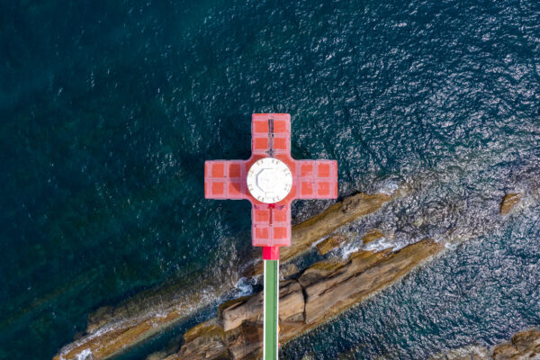 Monumental red cross ocean marker, Ashizuri Aquarium.