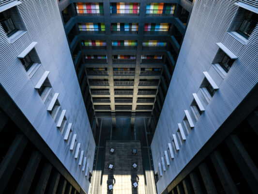 Vibrant coworking space with geometric window patterns, Odaiba.