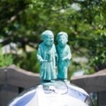 Mizuki Shigerus fantasy bronze children statues on sphere