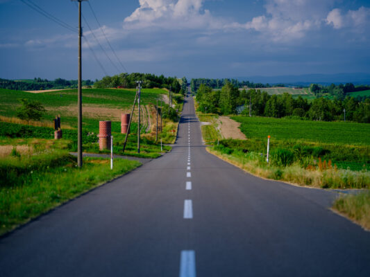 Scenic Rural Road Winding Through Lush Countryside