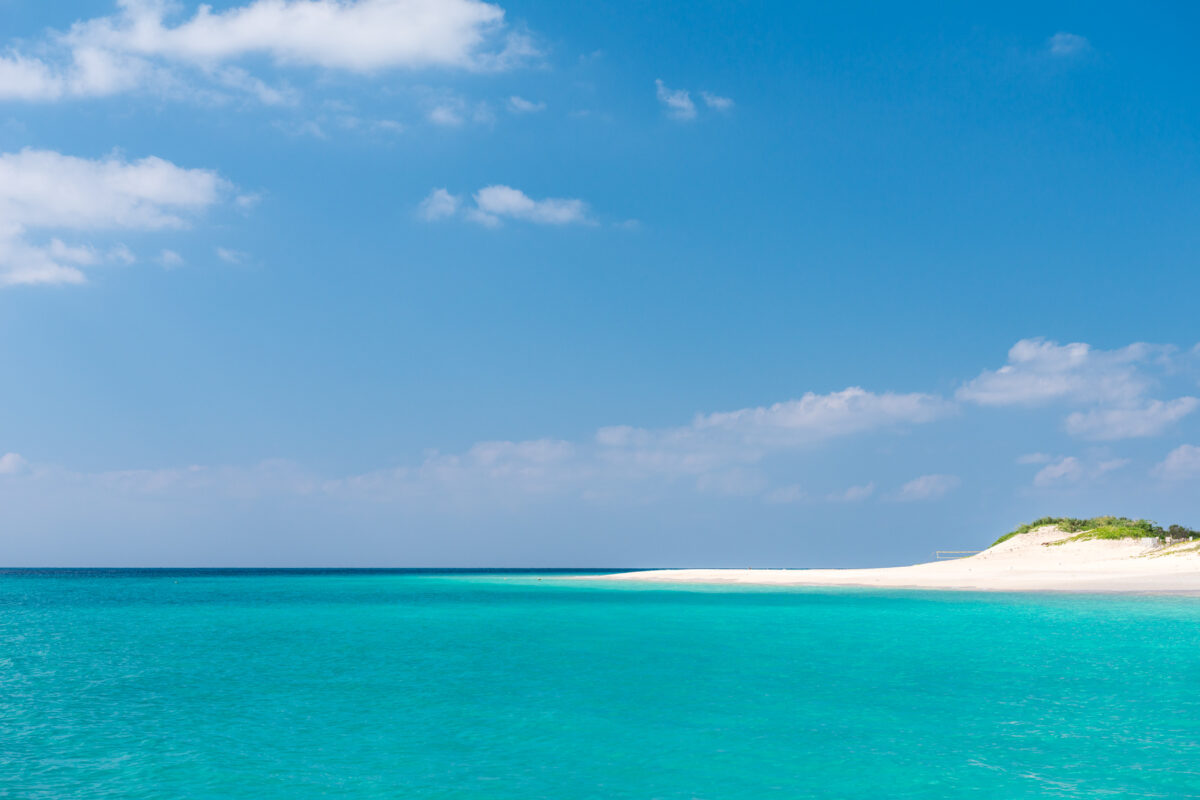 Miyako Island beach with turquoise water, white sand, and clear blue sky