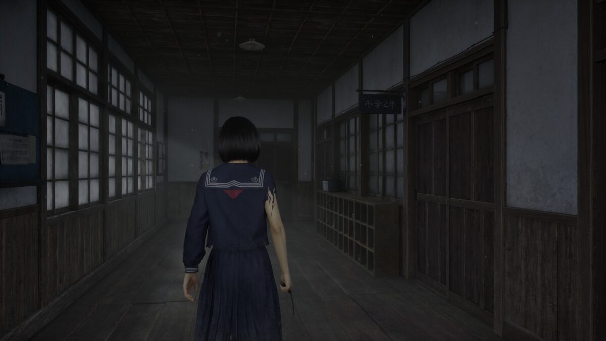 Lonely girl in dark abandoned Japanese school hallway with eerie lighting and vintage atmosphere.