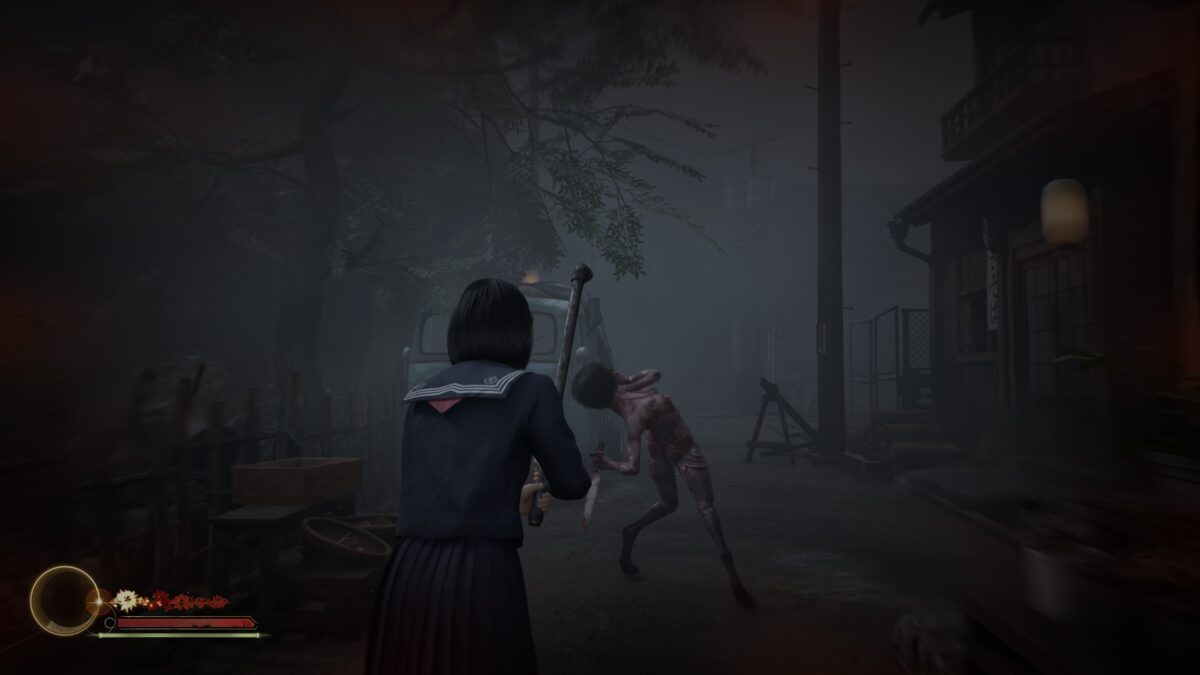 Schoolgirl battles monster in foggy Japanese street horror game scene at night.