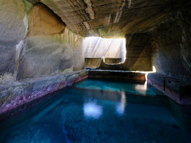 Turquoise whispers Echo through the caverns' heart— Sunlit secrets bloom. 青いささやき 洞窟の心に響く— 陽の秘密咲く。 #cavebath #onsen #japantravel #offbeatjapan #hiddenjapan #serenebeauty #turquoisewaters #naturelovers