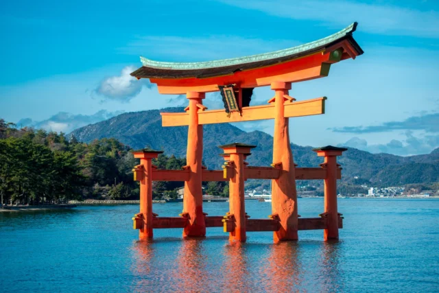 Vermilion whispers, Floating over blue embrace— Spirit’s quiet dance.  朱色の囁き、 青の抱擁に浮かぶ— 静かな霊の舞。  #Itsukushima #Miyajima #Hiroshima #torii #floatinggate #offbeatjapan #japan