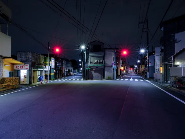 Blue night whispers here, Red lights dance with signs aglow, Takoyaki dreams. 青い夜ささやく 赤い光舞う 看板は輝く たこ焼きの夢 #offbeatjapan #japan #takoyaki #japanstreetnight #urbanserenity #neonnights #suburbansoil #quietstreets