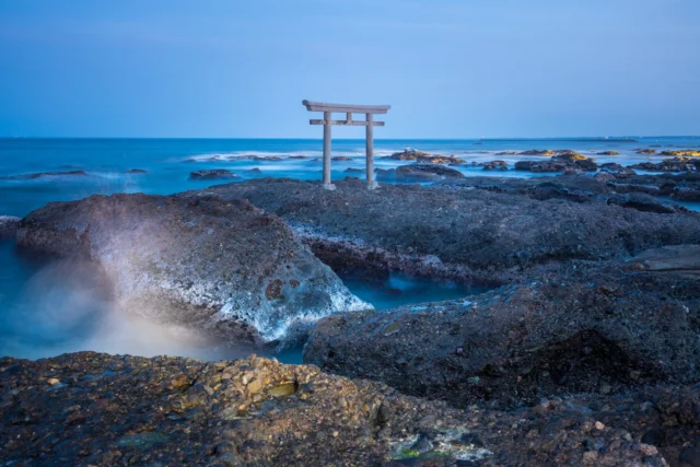 Eternal blue mist, Torii guards the ocean's breath, Whispers from the past.永遠の青霧 鳥居が海の息を守る 過去からのささやき#ToriiSpirit #CoastalJapan #SacredSeas #VolcanicRocks #BlueDusk #offbeatjapan #japan