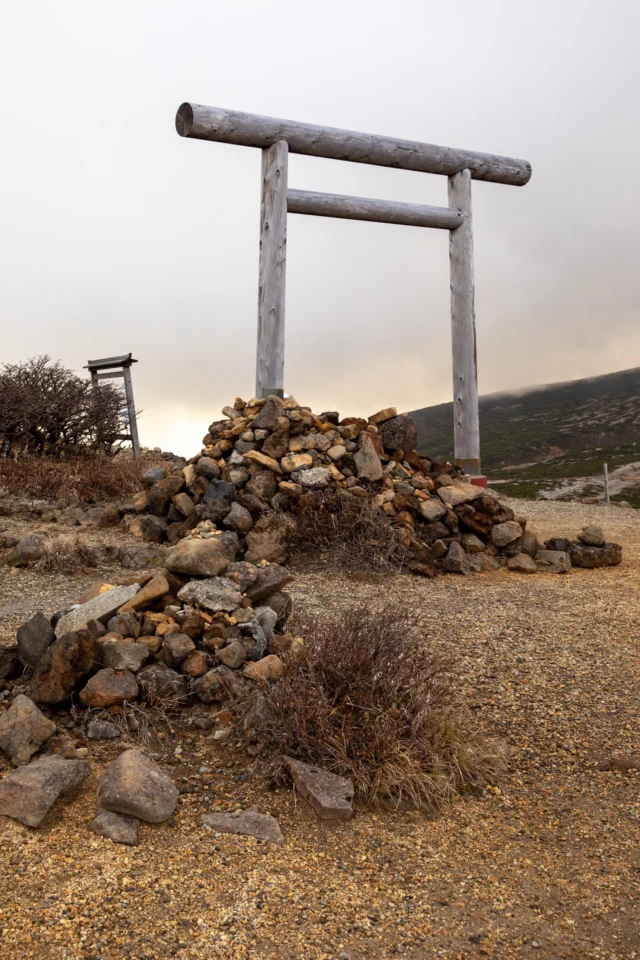 Ancient wood whispers, Torii guards the muted skies— Nature's solemn gate.---古木が囁く 鳥居は曇り空を守る— 自然の厳かな門 ---#torii #sacredjapan #mysticalplaces #spiritualjapan #quietbeauty #offbeatjapan #japan